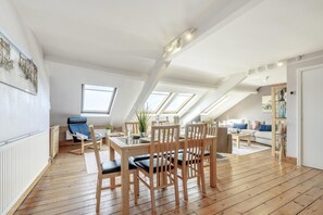 A spacious loft with a dining area, a living room, and a bedroom. - 2 Bed in Whitby (oc-w016) (Whitby)
