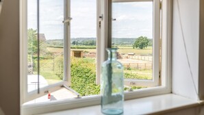A window with a view of a rural landscape, including fields and a tree. - 3 Bed in Cawton (oc-t32407) (Cawton)