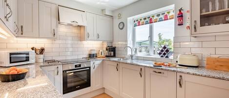 Microwave, oven, high chair, cookware/dishes/utensils