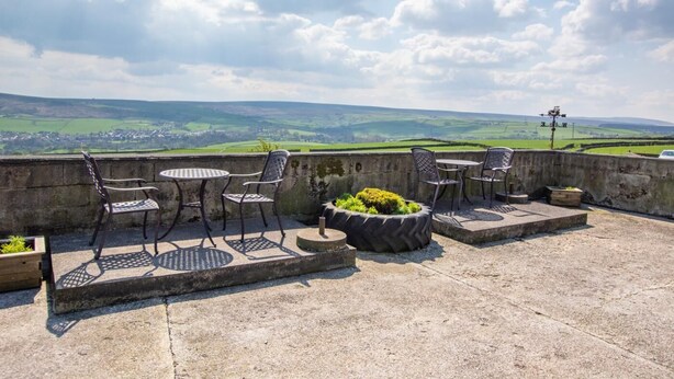 An outdoor patio with a view of rolling hills and a clear sky. - 2 Bed in Cowling (oc-ds239) (Cowling)