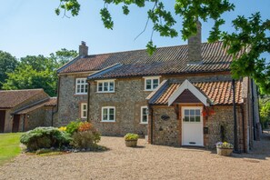 A stone building with a tiled roof, a white door, and a sign that reads "Hotel". - 5 Bed in Sidestrand (oc-bize) (Trimingham)
