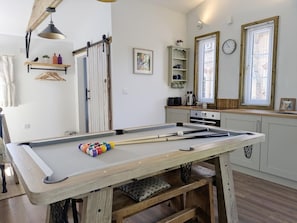 A pool table in a room with a wooden bench, a hanging light fixture, and a window with blinds. - 1 Bed in Lawnhead (oc-w32576) (Gnosall)