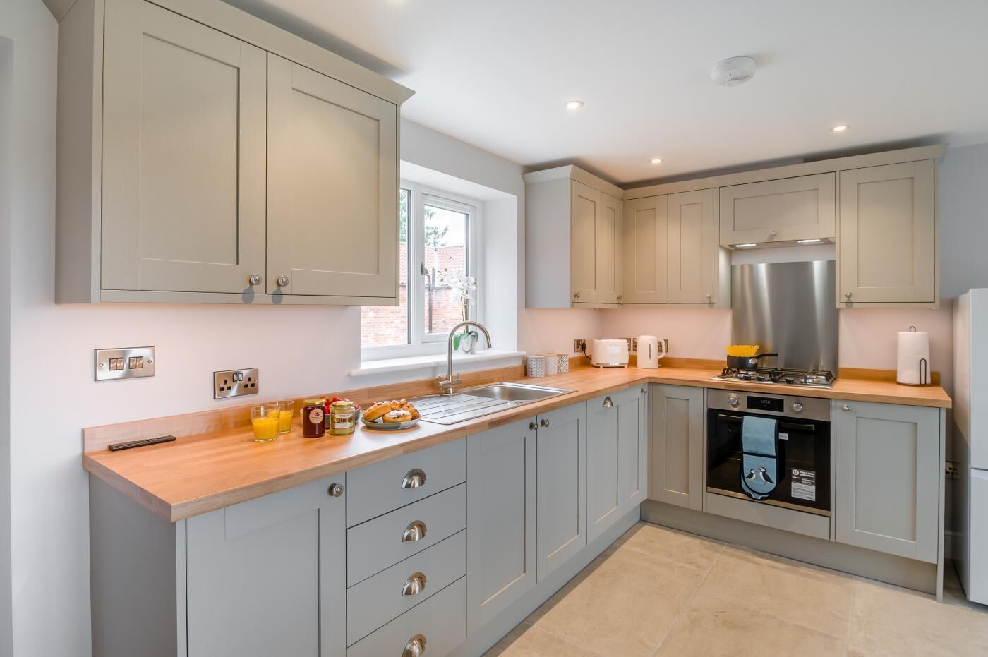 Oven, dishwasher, high chair, cookware/dishes/utensils