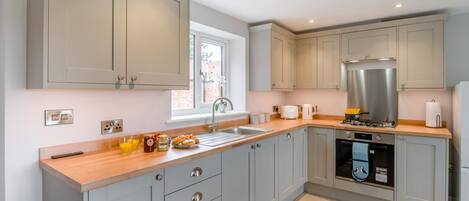 Oven, dishwasher, high chair, cookware/dishes/utensils