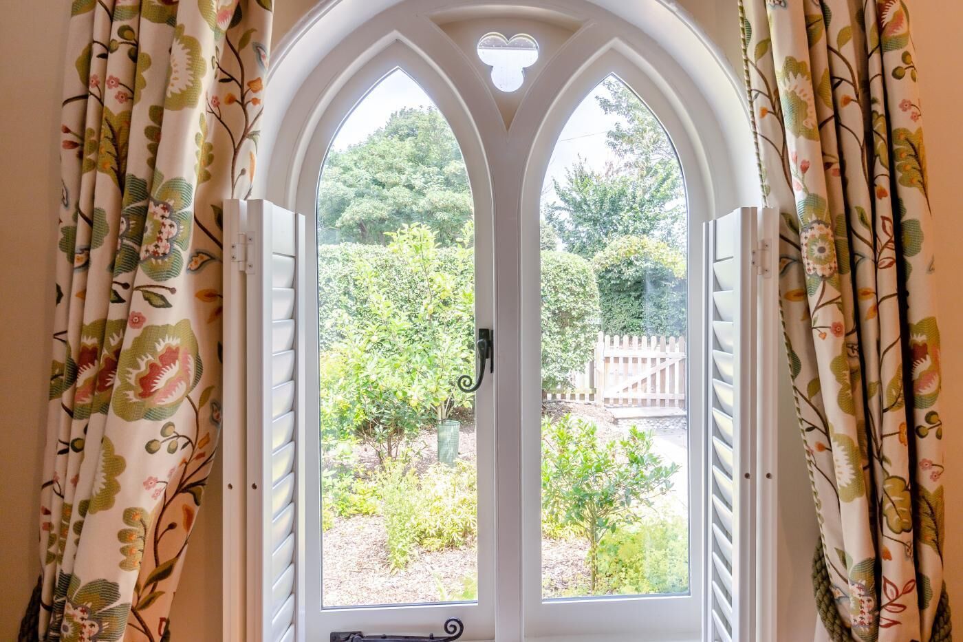 A doorway with a white frame and a heart-shaped window.