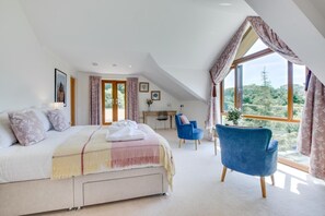 A bedroom with a bed, a desk, a chair, and large windows. - 7 Bed in Ashton (oc-p00891) (Germoe)