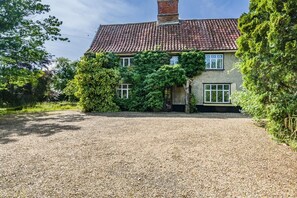 A house with a gravel driveway, a red-tiled roof, and ivy-covered walls. - 4 Bed in St. Nicholas South Elmham (oc-o32397) (All Saints South Elmham)