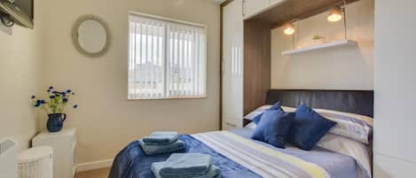 Iron/ironing board, travel crib, free WiFi, bed sheets