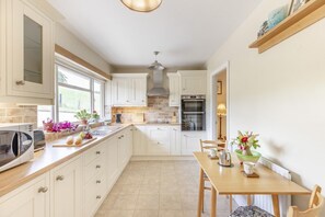 Microwave, oven, high chair, cookware/dishes/utensils