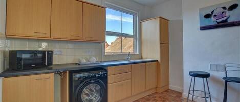 Microwave, oven, cookware/dishes/utensils