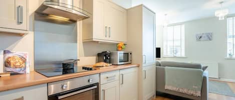 Oven, dishwasher, high chair, cookware/dishes/utensils