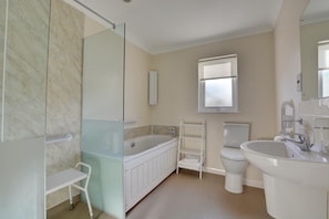 A modern bathroom with a glass shower enclosure, a bathtub, a toilet, and a sink. - 2 Bed in Attleborough (oc-1277) (Old Buckenham)