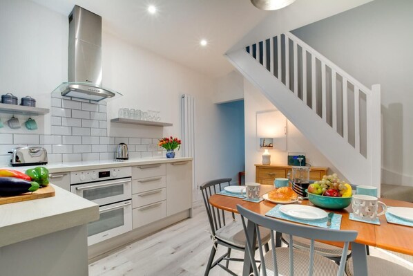 Oven, dishwasher, high chair, cookware/dishes/utensils