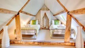 A cozy attic bedroom with two beds, wooden beams, and a skylight. - 2 Bed in Briston (oc-1551) (Briston)