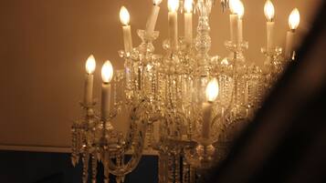 A chandelier with multiple candles.