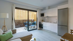 A modern apartment with a living room, dining area, and kitchen. - Golden Sunrise By CanariasGetaway (Mogán)