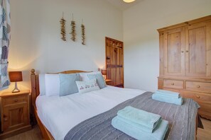 Tabla de planchar con plancha, wifi gratis y ropa de cama 