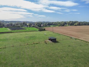 A rural landscape with a fenced field, a small building, and distant trees. - 2 Bed in Stelling Minnis (oc-ek715) (Lyminge)