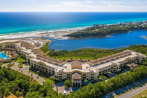A large resort with multiple buildings, a swimming pool, and a beachfront. - Amazing Condo on the Beach on 30A! (Santa Rosa Beach)