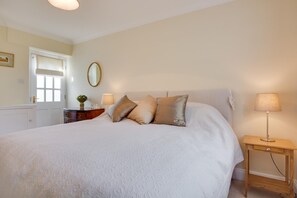 Tabla de planchar con plancha, wifi gratis y ropa de cama 