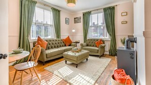 A cozy living room with a sofa set, a dining table with chairs, and a small side table. - 2 Bed in Cromer (oc-s32971) (Cromer)