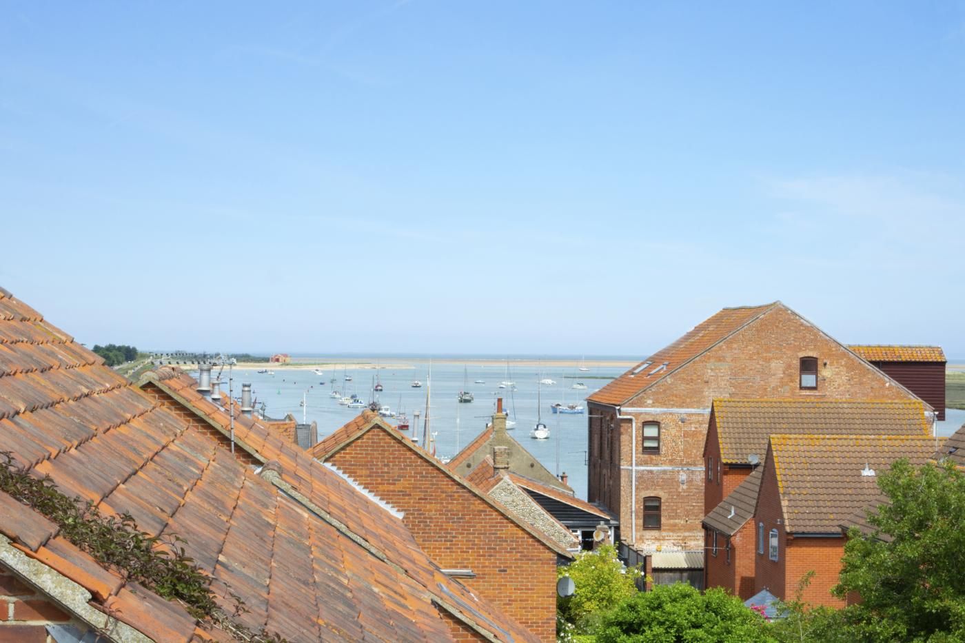A coastal town with terraced houses and a marina.