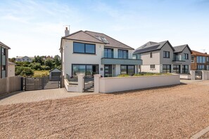 A modern two-story house with a driveway and a gated entrance. - 5 Bed in Walmer (oc-do022) (Kingsdown)