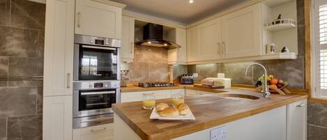 Oven, dishwasher, highchair, cookware/dishes/utensils