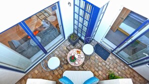 A modern apartment with large glass doors leading to a patio area. - 2 Bed in Southwold (oc-wtp) (Southwold)