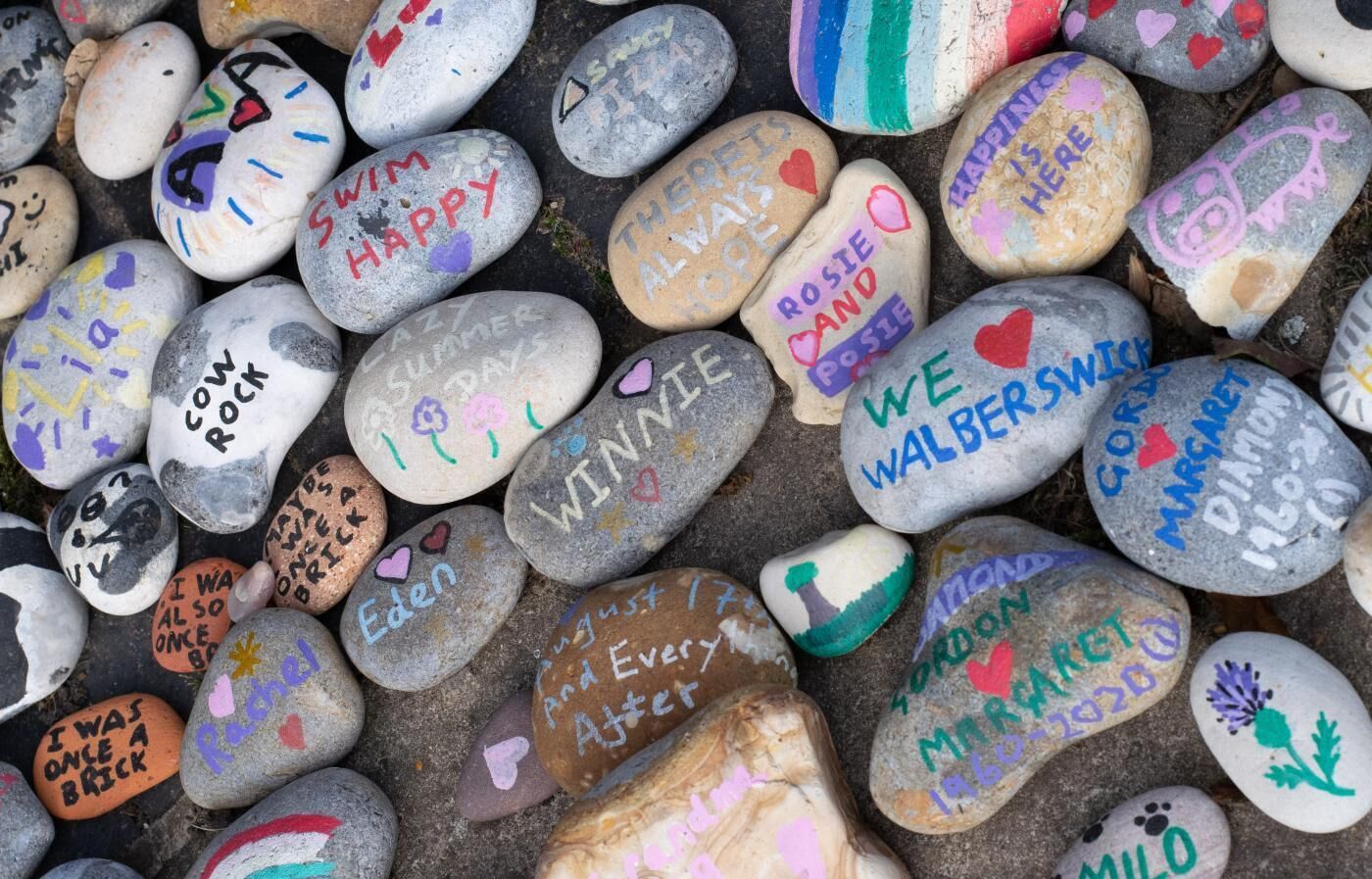 A collection of stones with various inscriptions and drawings.