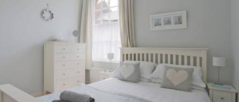 Iron/ironing board, travel crib, free WiFi, bed sheets