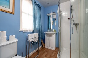 Shower, hair dryer, towels, soap