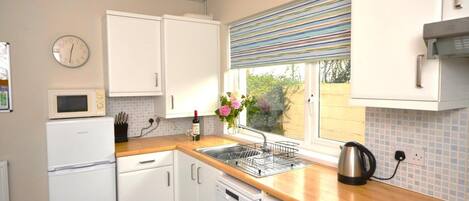 Microwave, oven, high chair, cookware/dishes/utensils