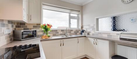 Microwave, oven, cookware/dishes/utensils