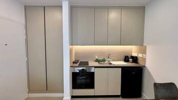 Superior Studio Suite, Balcony | Private kitchen | Mini-fridge, microwave, oven, stovetop