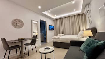 Superior Studio Suite, Balcony | Living area