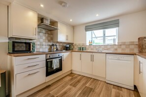 Oven, dishwasher, highchair, cookware/dishes/utensils