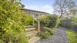 A stone building with a stone staircase leading to a wooden door. - 3 Bed in Moylegrove (oc-s33507) (Cardigan)