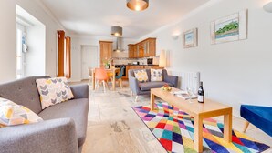 A modern apartment with a living room, dining area, and kitchen. - 2 Bed in Marazion (oc-p00598) (Marazion)