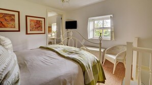 A bedroom with a bed, a chair, a desk, a television, and a window. - 1 Bed in Stanhoe (oc-1792) (Stanhoe)