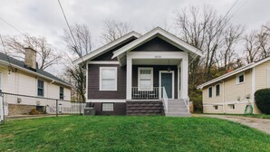 A two-story house with a front porch, a visible number '3508' on the front, and a well-maintained lawn. - Hyde Park 3BR Home with Fenced Backyard (Cincinnati)