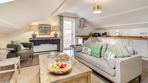 A cozy loft apartment with a dining area, a sofa set, a kitchen, and a balcony. - 2 Bed in Dunsop Bridge (oc-w33525) (Dunsop Bridge)
