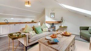 A modern loft apartment with a kitchen, living area, and a fireplace. - 2 Bed in Dunsop Bridge (oc-w33525) (Dunsop Bridge)