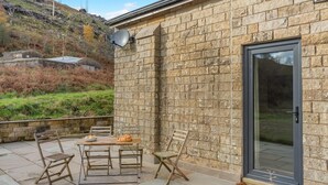A stone building with a door and a satellite dish. - 2 Bed in Dunsop Bridge (oc-w33525) (Dunsop Bridge)