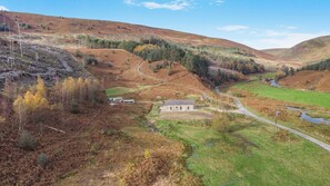 A rural landscape with a house surrounded by fields and a small stream. - 2 Bed in Dunsop Bridge (oc-w33526) (Dunsop Bridge)