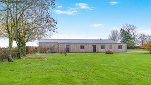 A single-story building with a flat roof, a front door, and a small porch area. - 2 Bed in Hinton Blewett (oc-g34070) (Hinton Blewett)