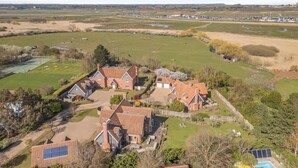 A large estate with multiple buildings, expansive green fields, and a swimming pool. - 5 Bed in Walberswick (oc-hlwal) (Walberswick)