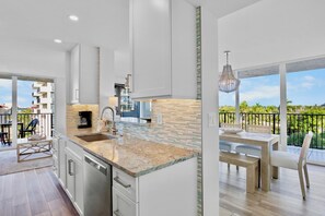 Fridge, coffee/tea maker, cookware/dishes/utensils - Our House at the Beach E-302 by Tropical Sands Accommodations (Siesta Key)