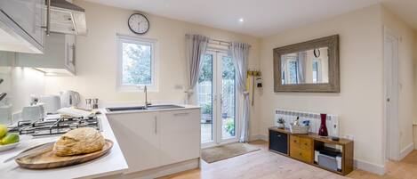 Microwave, dishwasher, high chair, cookware/dishes/utensils