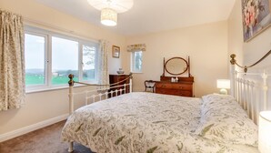 A bedroom with a bed, dresser, and a window with a view of the countryside. - 2 Bed in Renwick (oc-h34195) (Renwick)